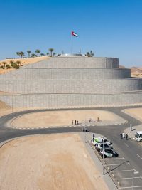 Precast MSE wall forming a landscaped artificial mountain